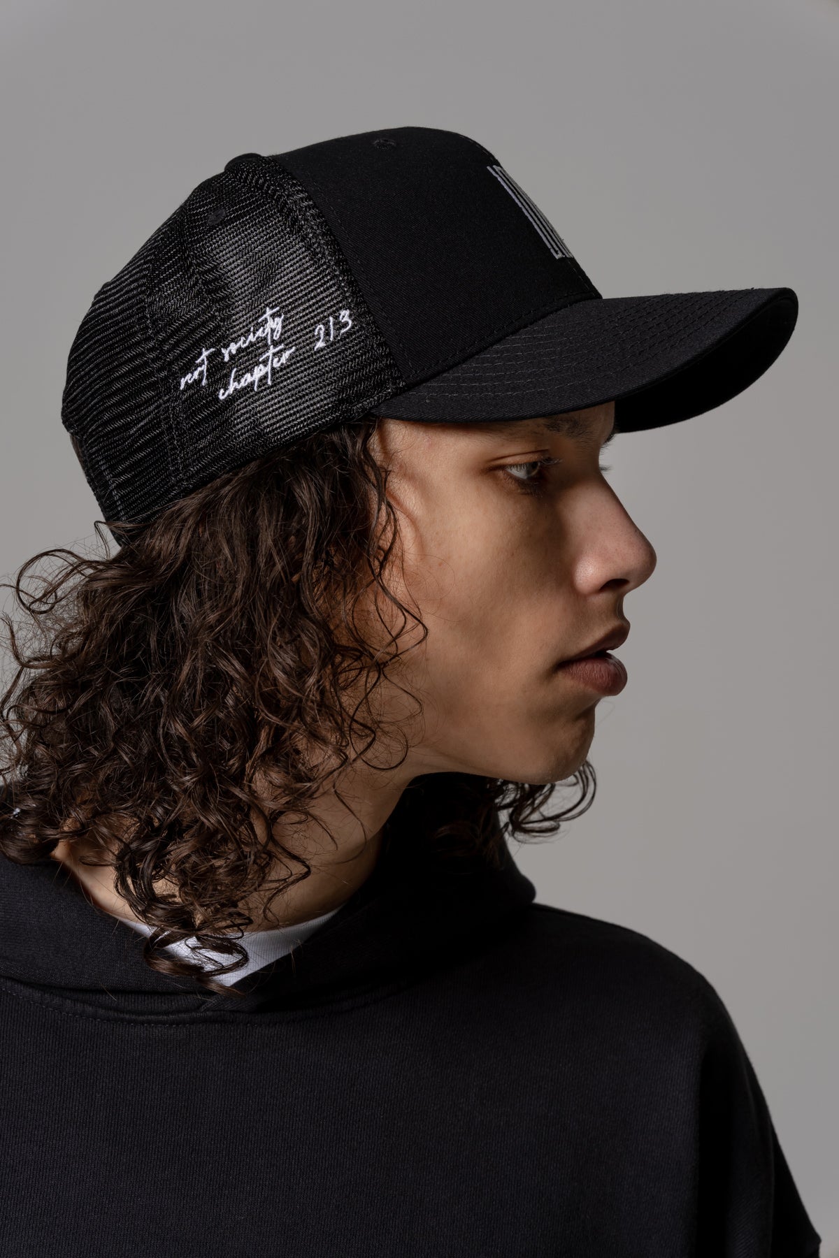 surf article 7 logo trucker hat